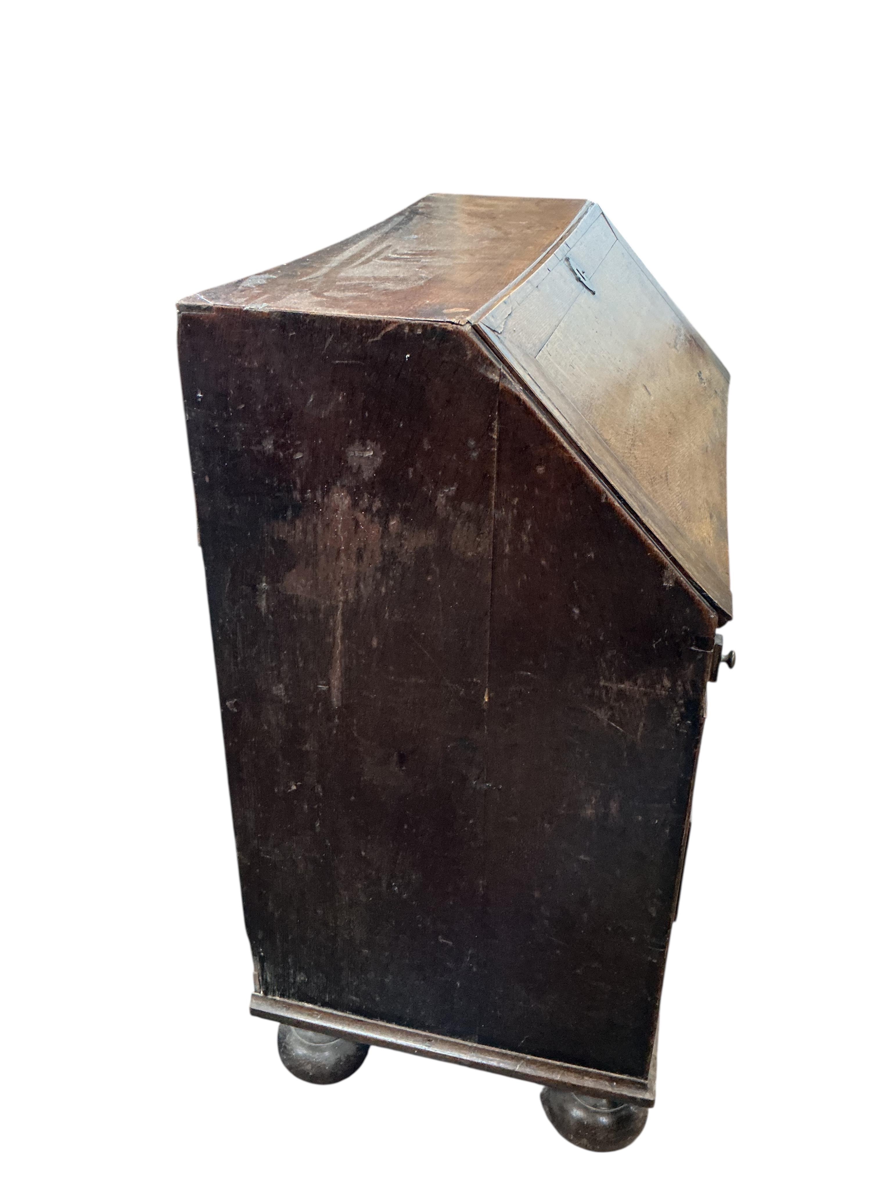 A mid 18th century oak bureau, width 86cm, depth 50cm, height 101cm